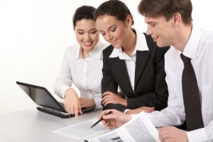 3 business people at computer launch intro dreamstime_xs_17503179