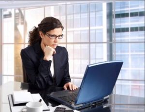 woman on computer with glasses